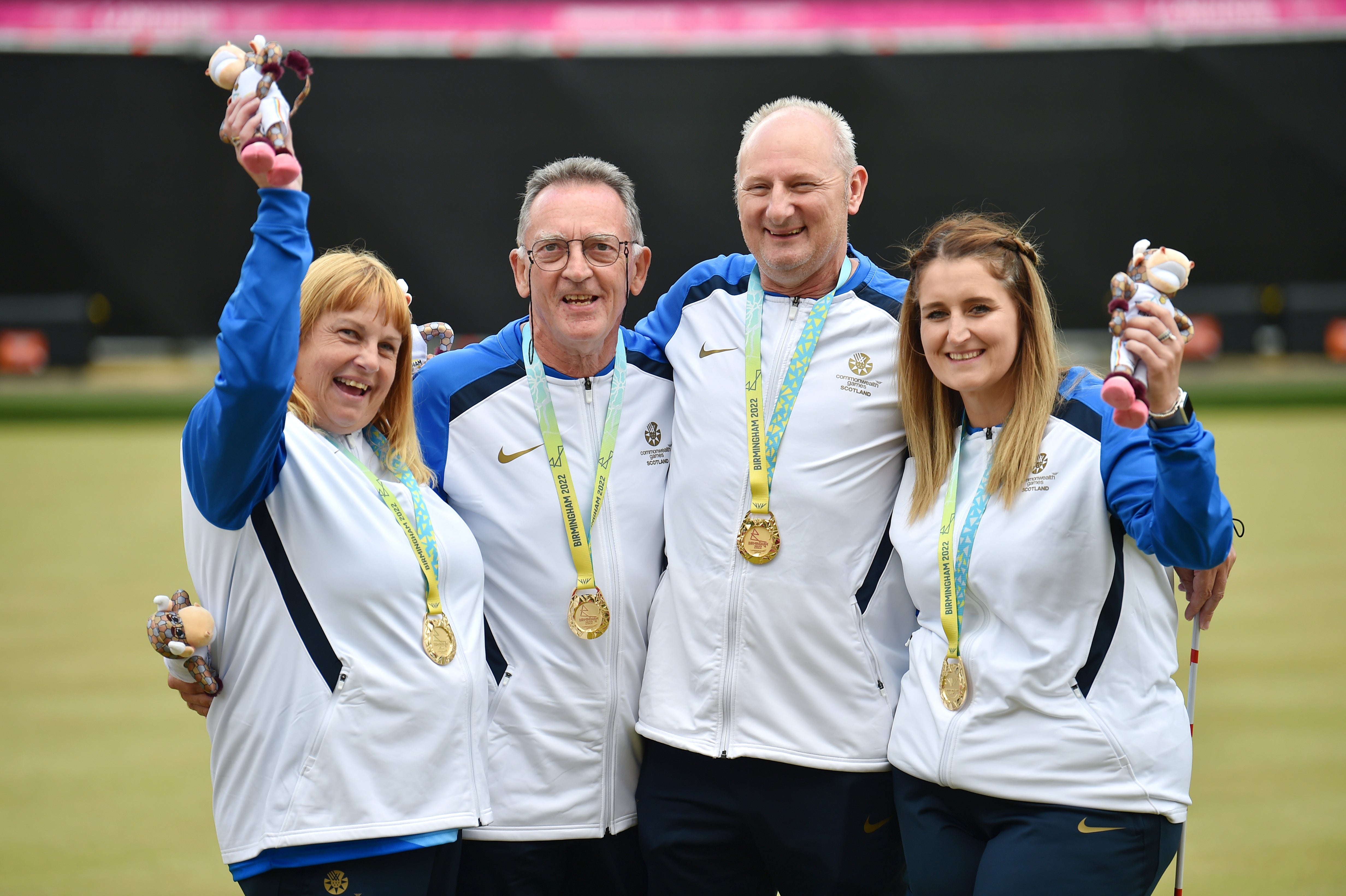 Gold medalists Melanie Inness, George Miller, Robert Barr and Sarah Jane Ewing of Team Scotland celebrate