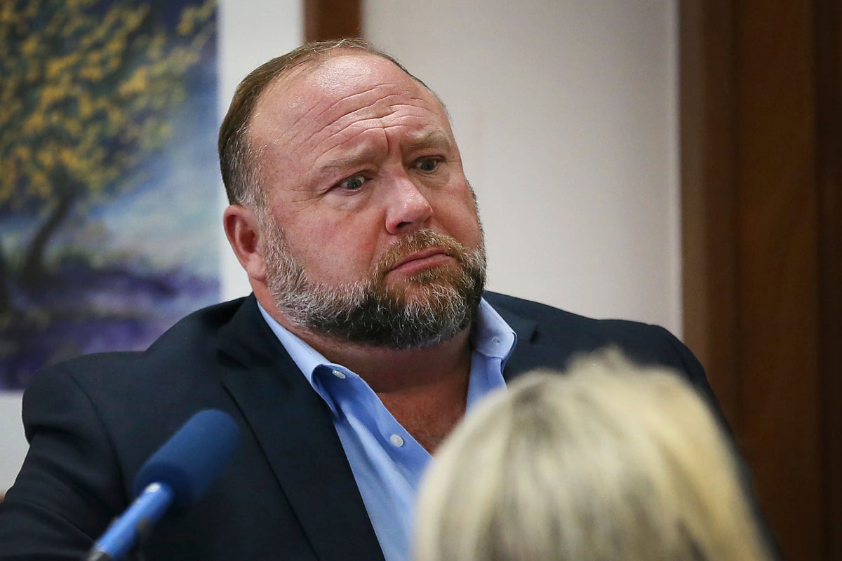 Alex Jones defamation trial – live: Sandy Hook conspiracy theorist blasted by judge minutes into hearing