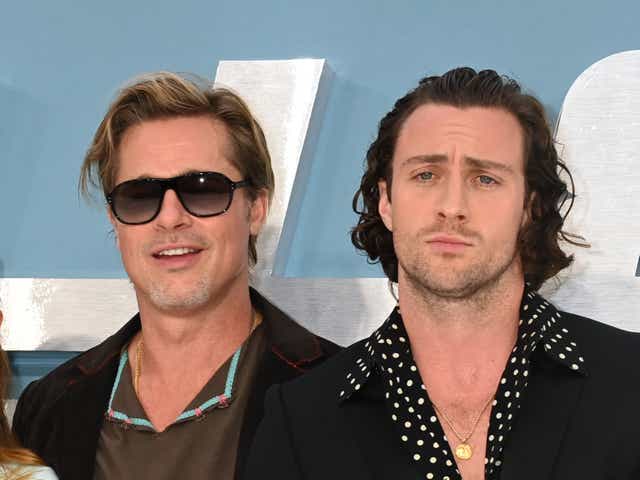 <p>Brad Pitt (left) and Aaron Taylor-Johnson</p>