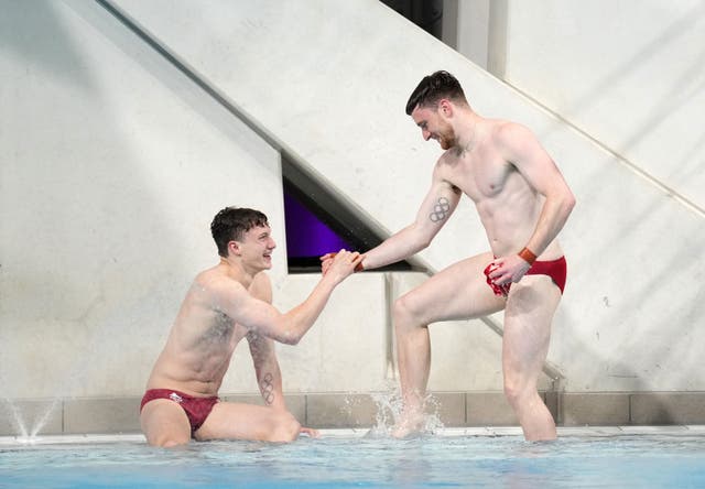 <p>Matty Lee and Noah Williams celebrate clinching gold with their final dive</p>