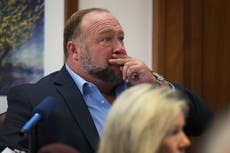 Alex Jones is accused of hiding millions of dollars to avoid paying Sandy Hook families