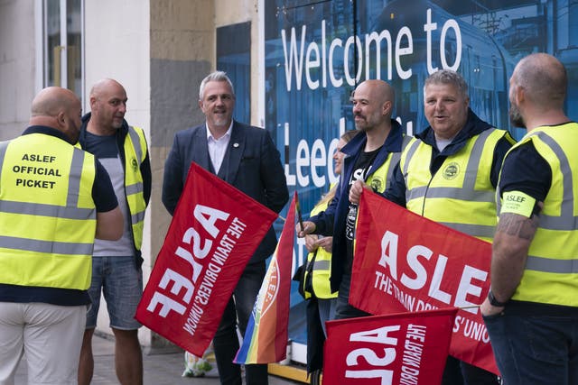 Protesters on the picket line outside Leeds railway station (Danny Lawson/PA)