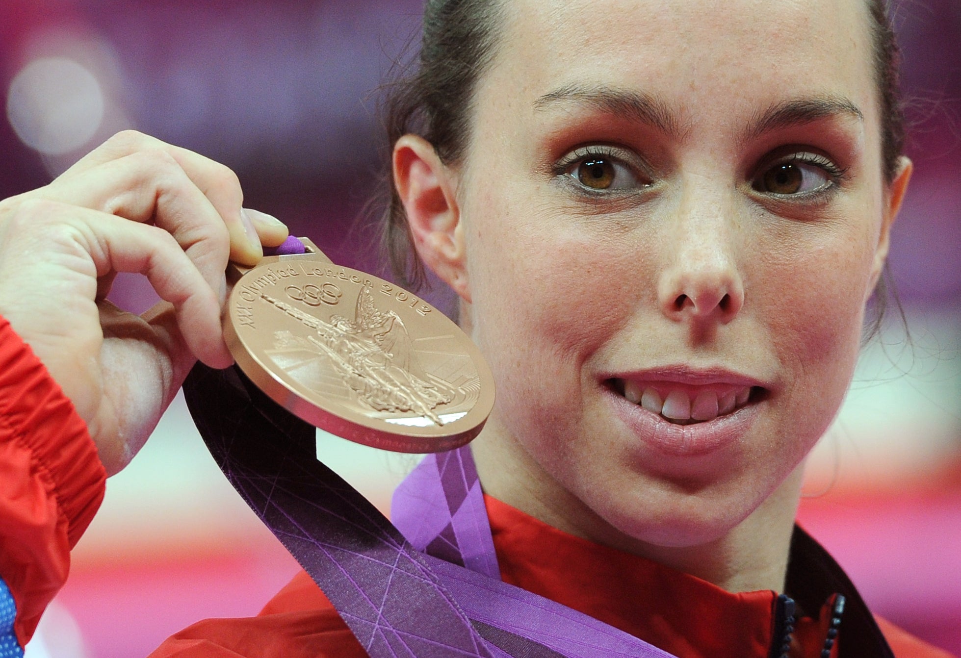 Great Britain’s Beth Tweddle celebrates with her bronze medal after the women’s uneven bars final at London 2012 (Anthony Devlin/PA)