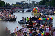 Huge crowds watch Amsterdam Pride's canal parade celebration