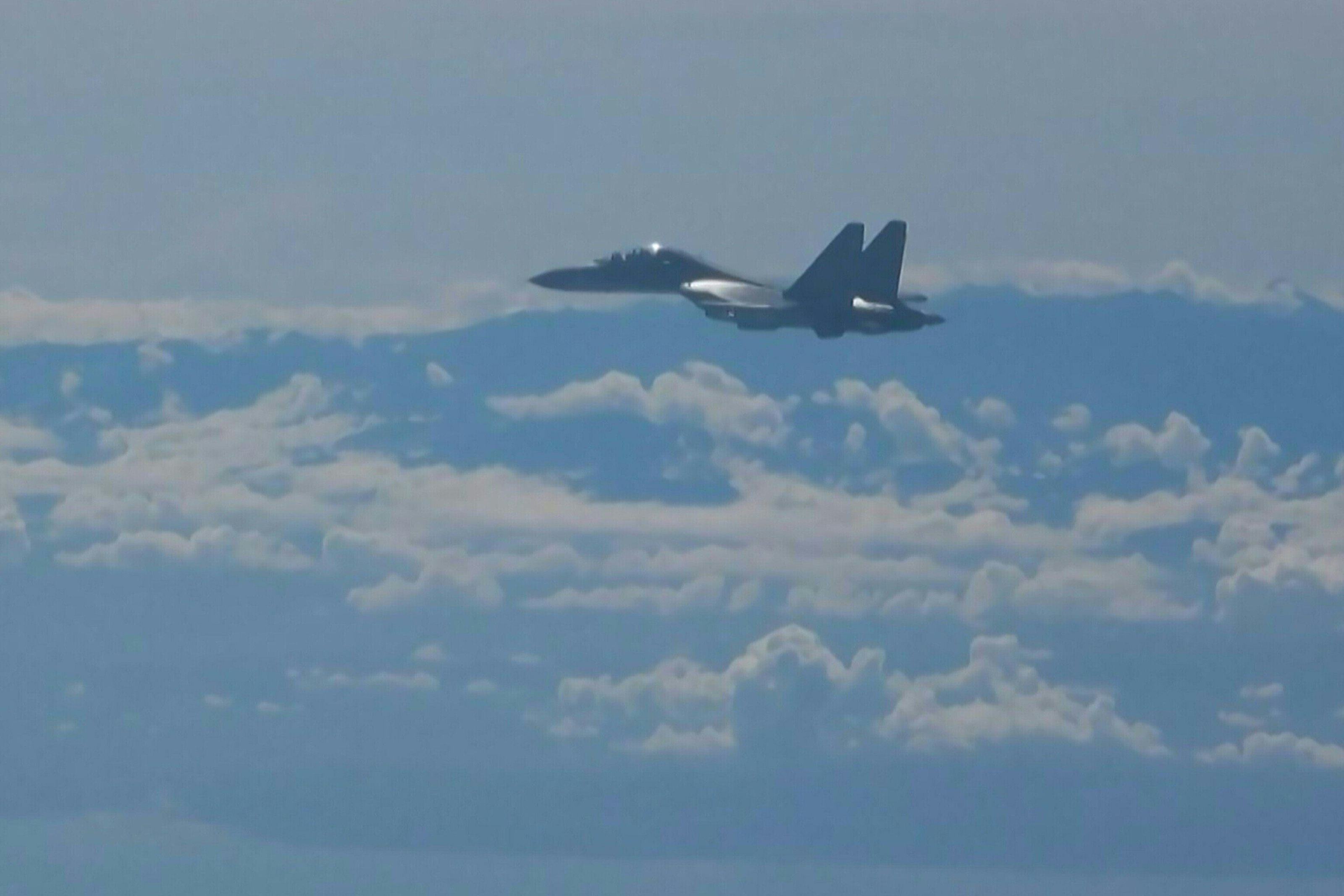 A Chinese military jet flies as part of military exercises near Taiwan on Friday