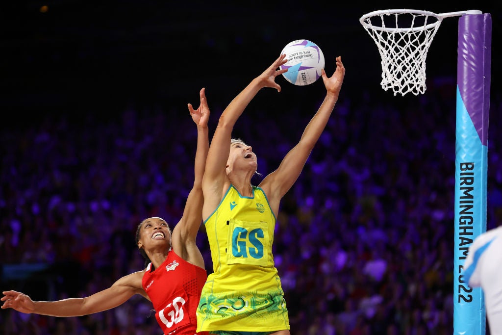 Australia’s Gretel Bueta and Layla Guscoth of England compete for the ball during their semi-final at the NEC Arena