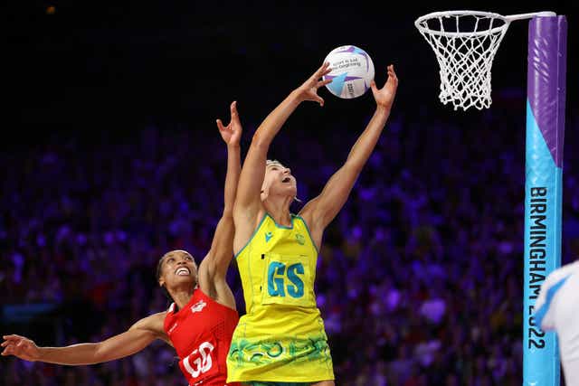 <p>Australia’s Gretel Bueta and Layla Guscoth of England compete for the ball during their semi-final at the NEC Arena</p>
