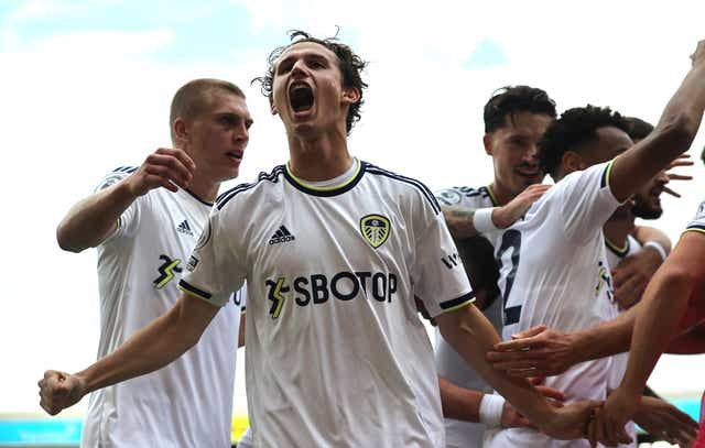 <p>Leeds’ Brenden Aaronson roars his delight after his team’s winner against Wolves </p>