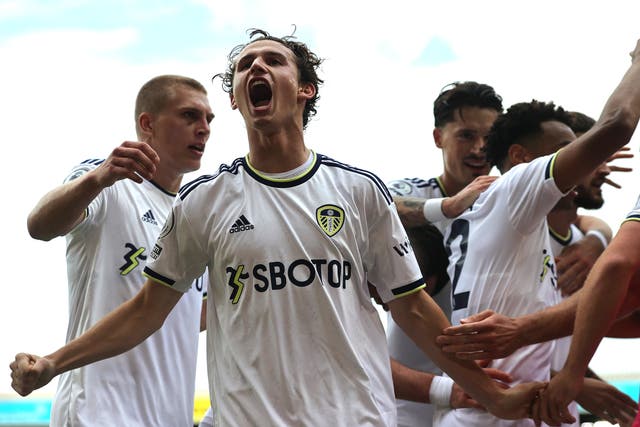 <p>Leeds’ Brenden Aaronson roars his delight after his team’s winner against Wolves </p>