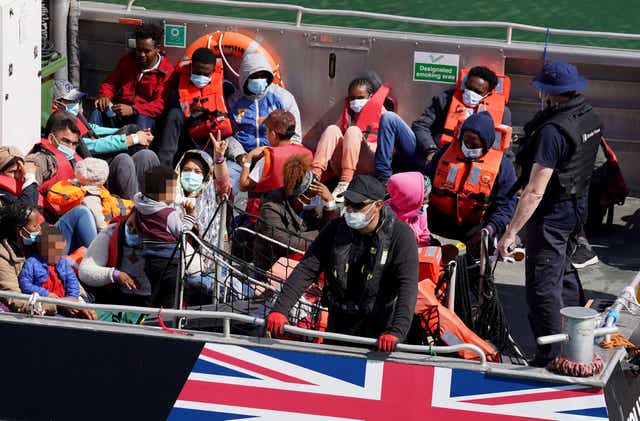 EDITORS NOTE Children’s faces have been pixelated as the PA Picture Desk has been unable to gain the necessary permission to photograph a child under 16 on issues involving their welfare. A group of people thought to be migrants are brought in to Dover, Kent, onboard a Border Force vessel following a small boat incident in the Channel (Gareth Fuller/PA)