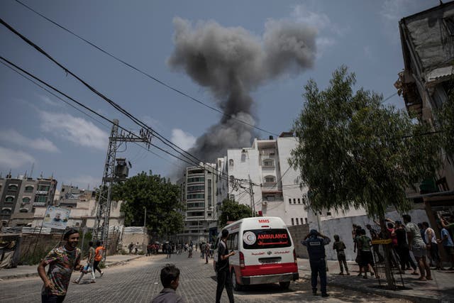 <p>Smoke rises after Israeli airstrikes on residential building in Gaza City on Saturday</p>