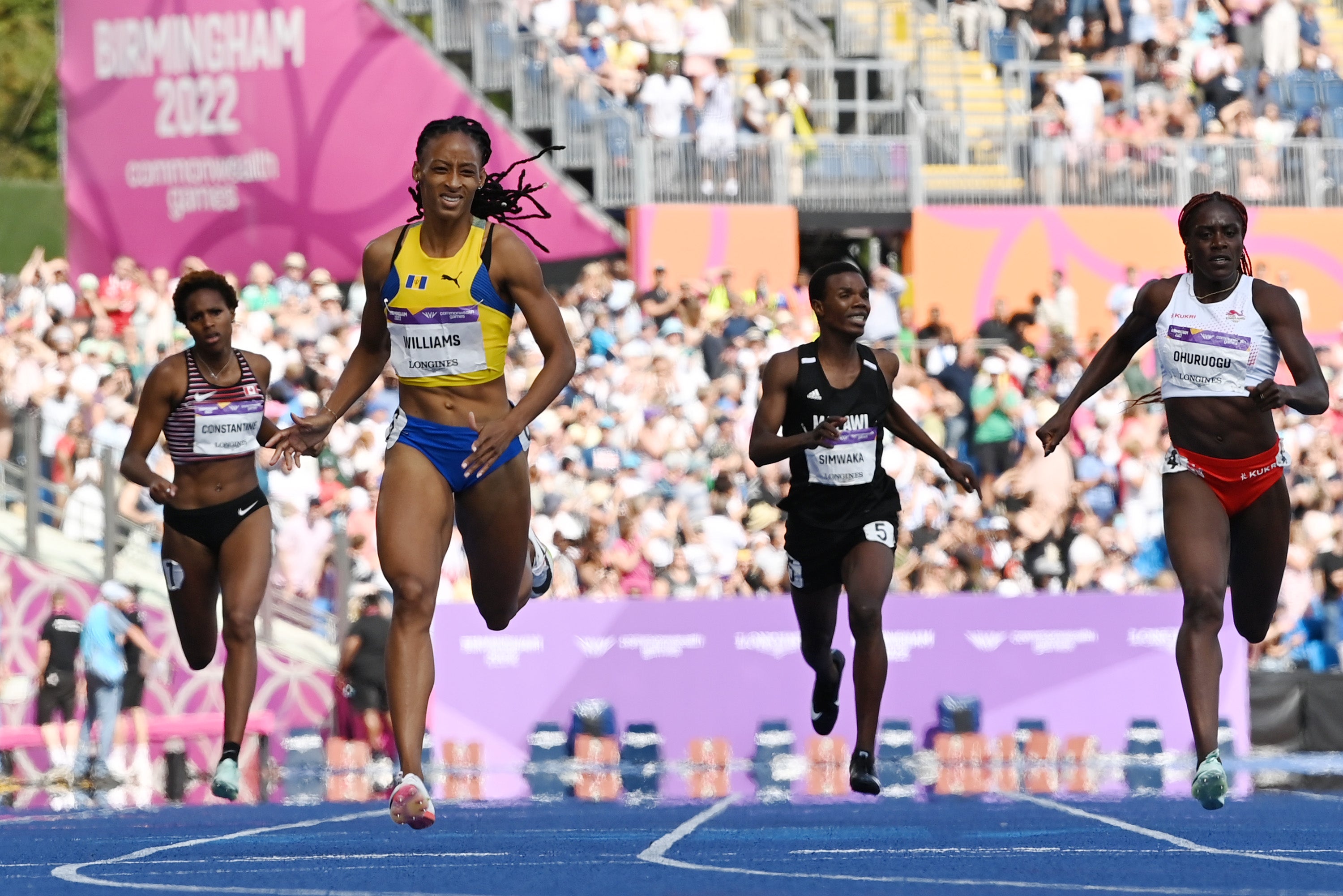 Sada Williams of Team Barbados crosses the finish line to win gold