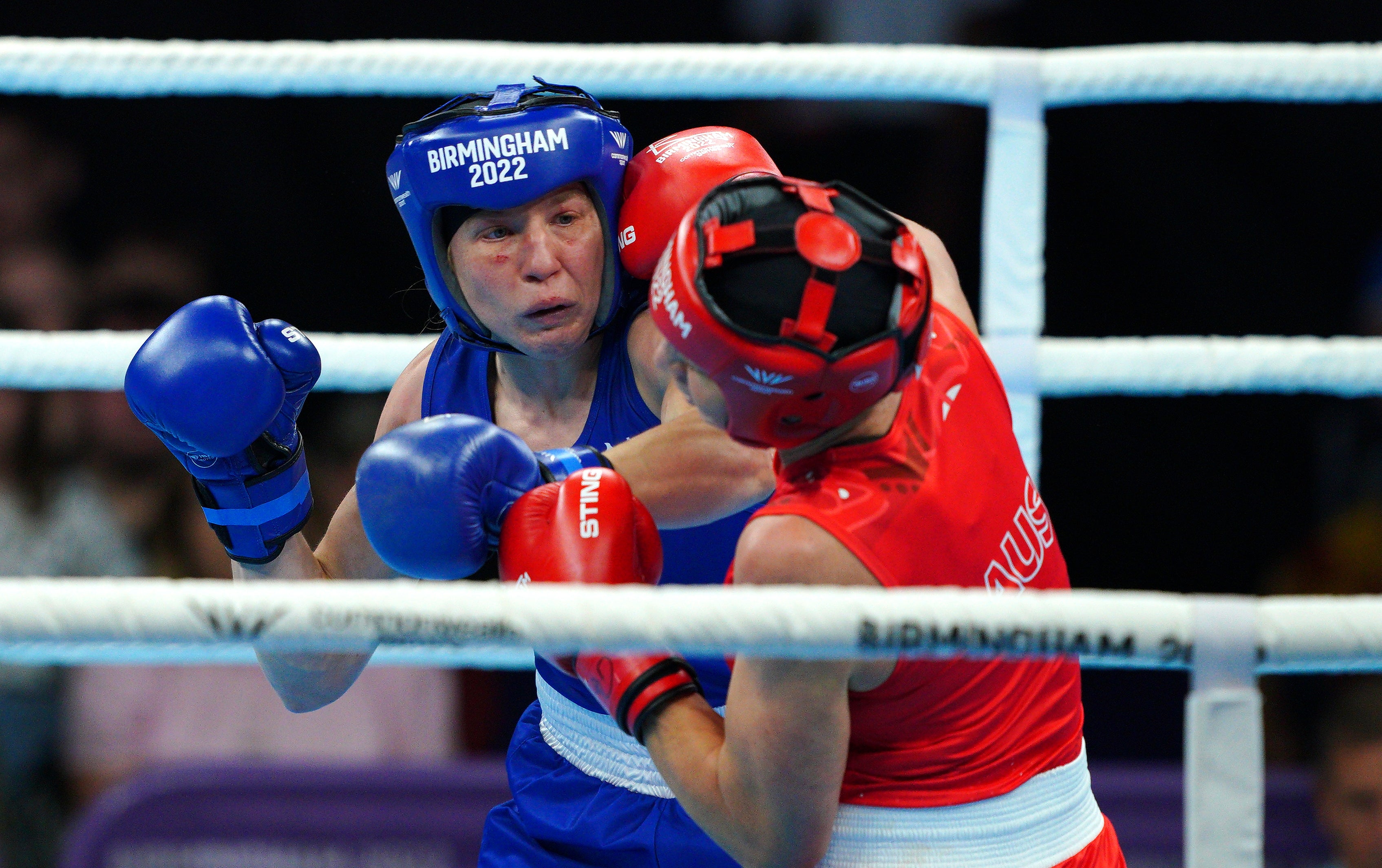 Rosie Eccles (blue) stopped Australia’s Kaye Scott to claim boxing gold (Peter Byrne/PA)