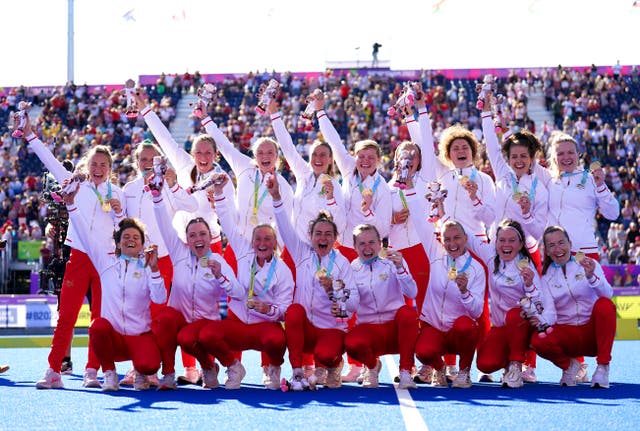 The England team celebrate with their gold medals after winning the women’s hockey final against Australia (Joe Giddens/PA)