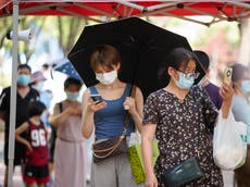 Covid outbreak traps almost 100,000 tourists in Chinese resort