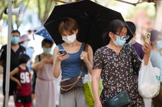 Covid outbreak traps almost 100,000 tourists in Chinese resort
