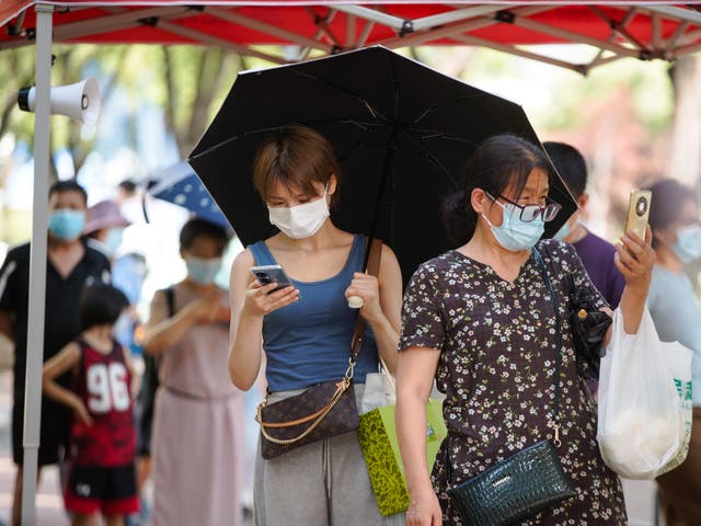 <p>People queue for coronavirus tests in Sanya, Hainan province </p>