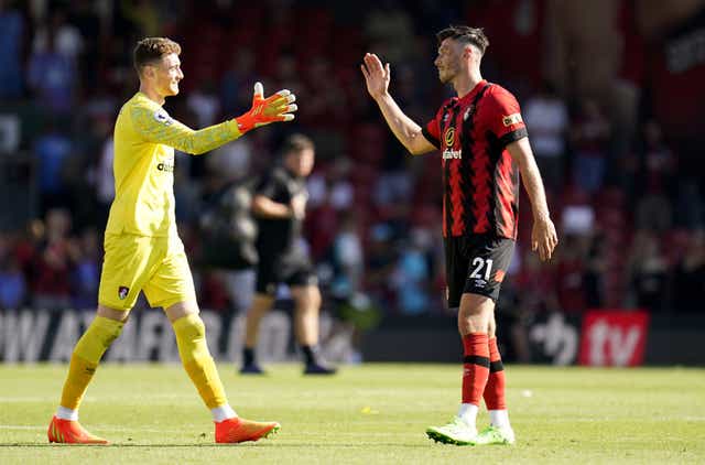 Bournemouth goalkeeper Mark Travers (left) and Kieffer Moore celebrate after the win over Aston Villa (Andrew Matthews/PA)