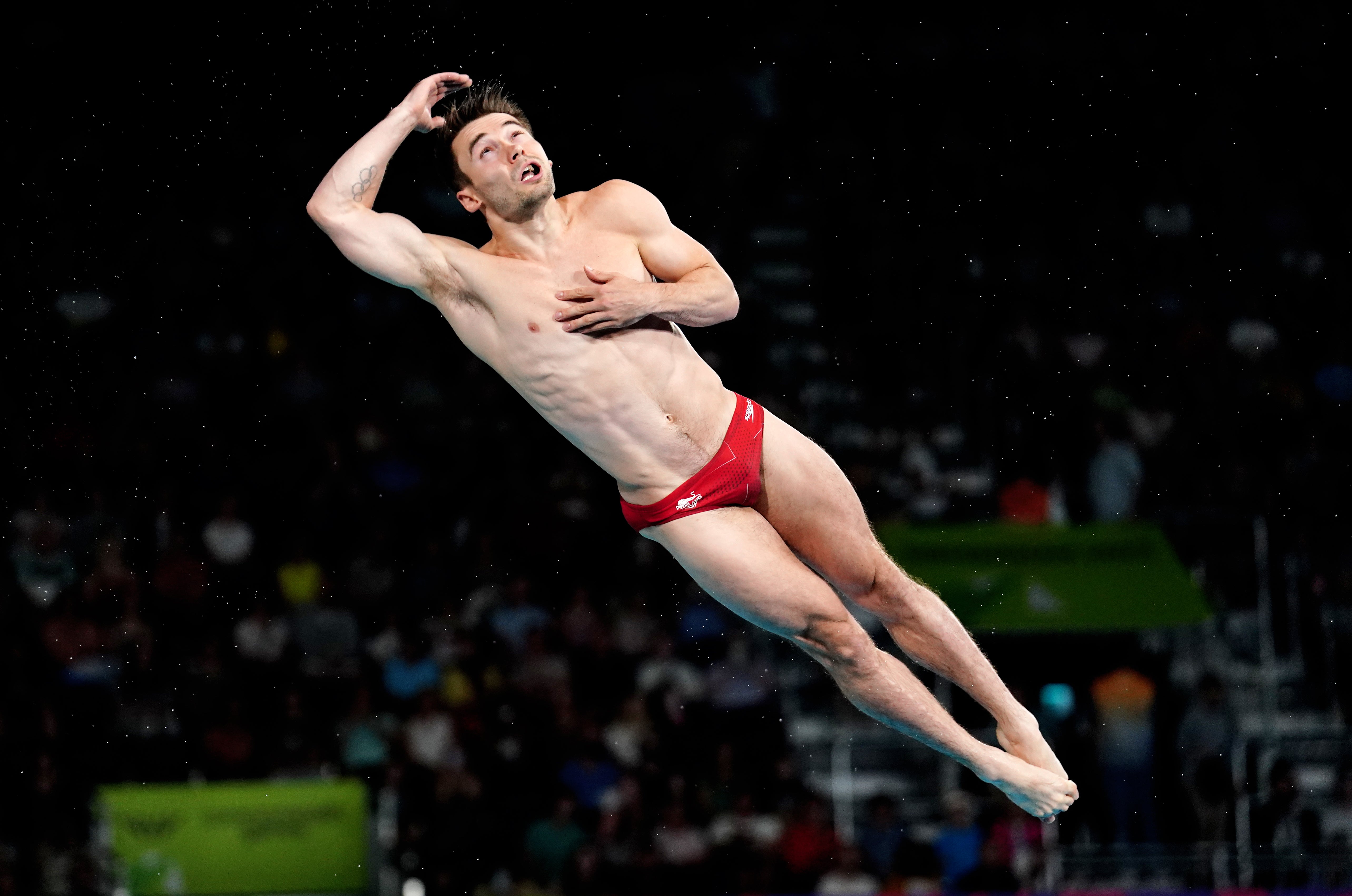 Daniel Goodfellow performing a dive in the men’s three-metre springboard final (David Davies/PA)