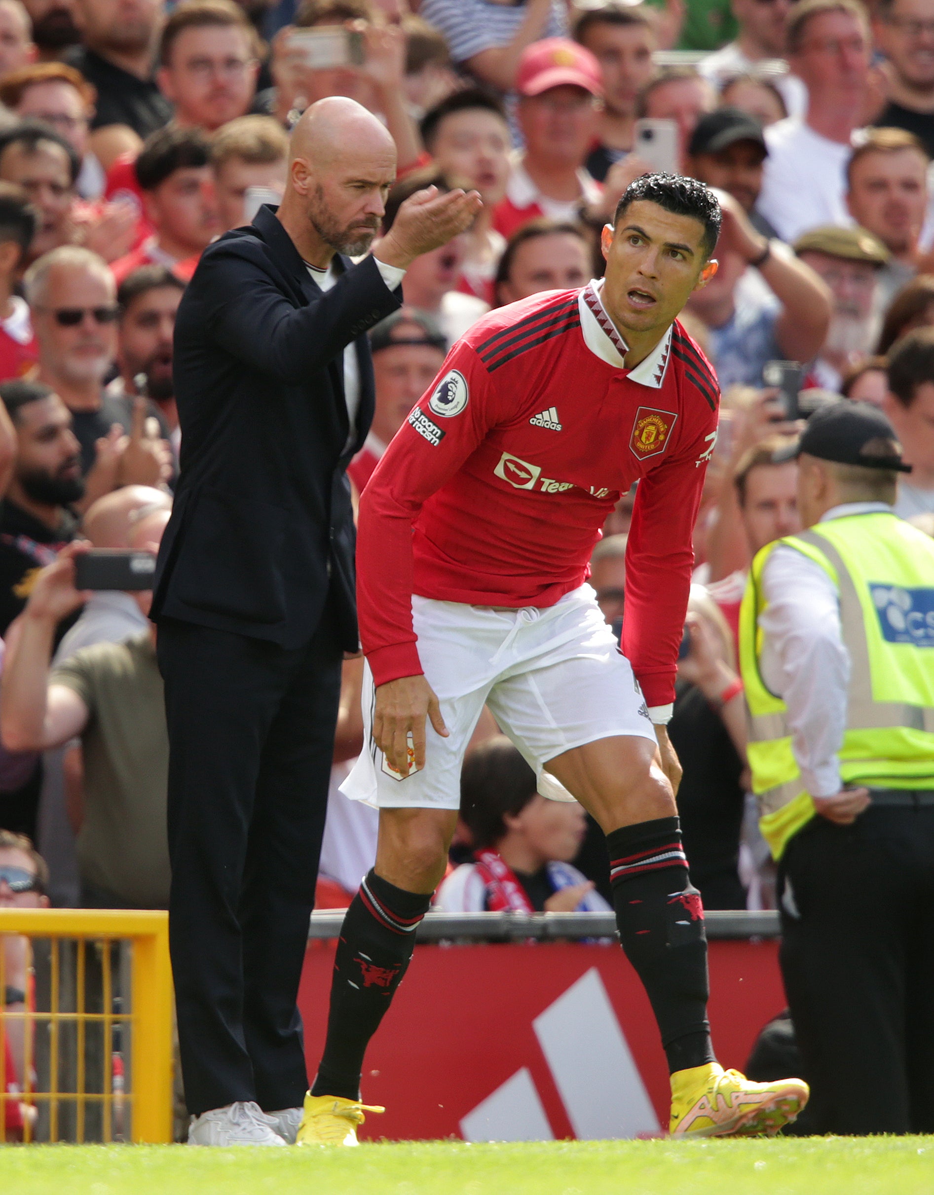 Manchester United manager Erik ten Hag, left, sends on substitute Cristiano Ronaldo (Ian Hodgson/PA)