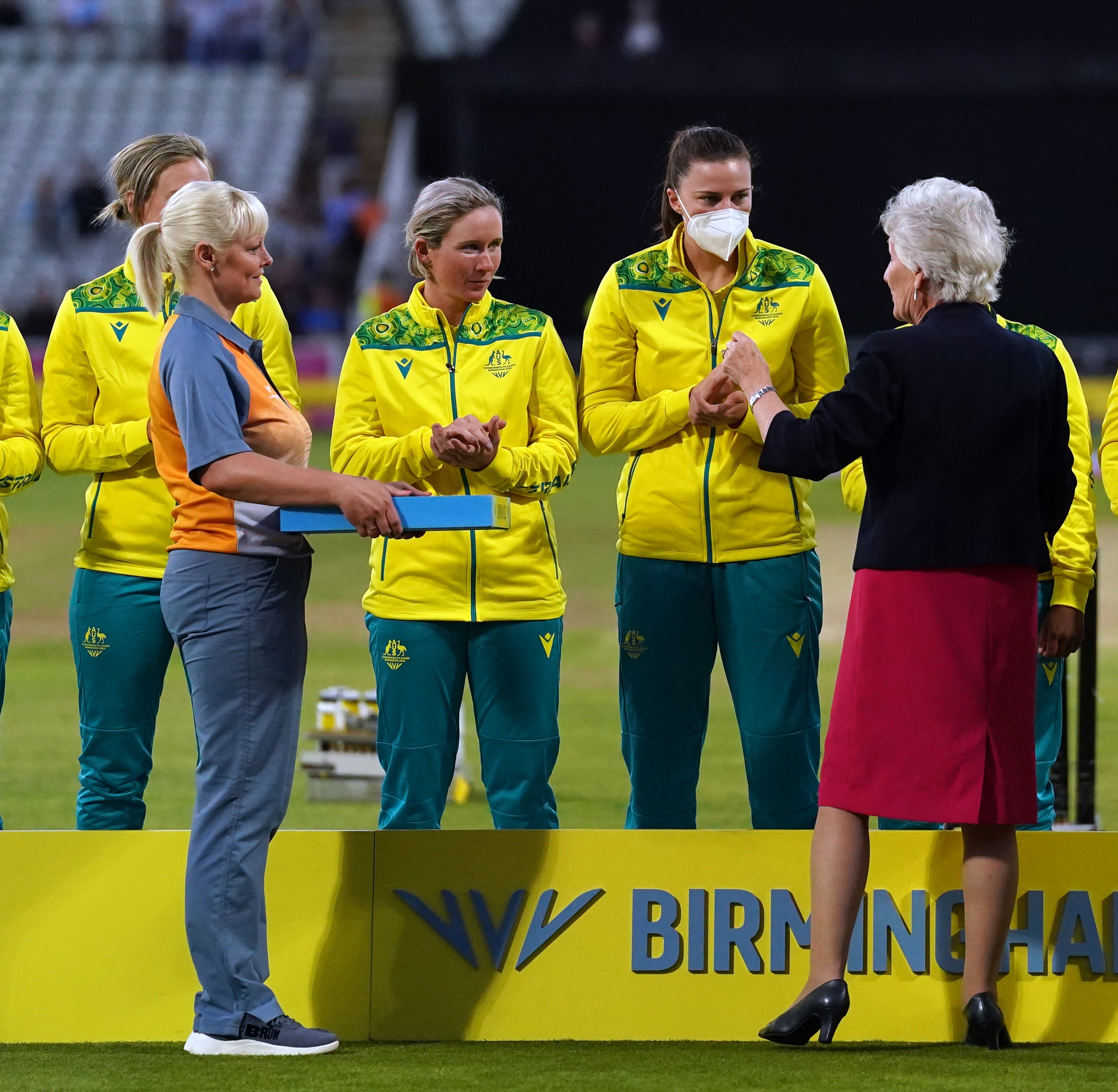Australia’s Tahlia McGrath receives her medal whilst wearing a mask due to receiving a positive covid-19 test (Adam Davy/PA)