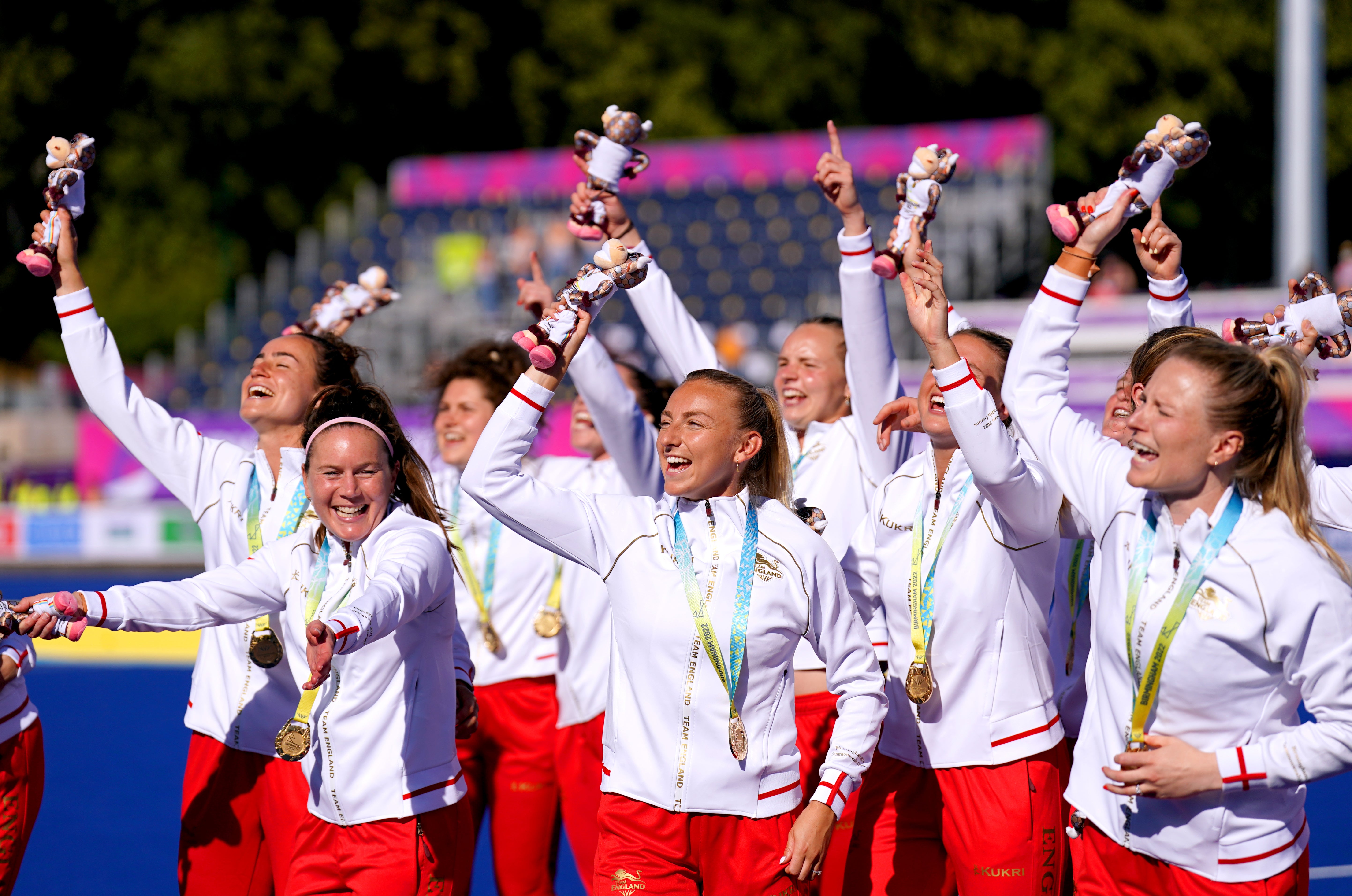 England’s hockey players celebrate with their gold medals at the Commonwealth Games (Joe Giddens/PA)
