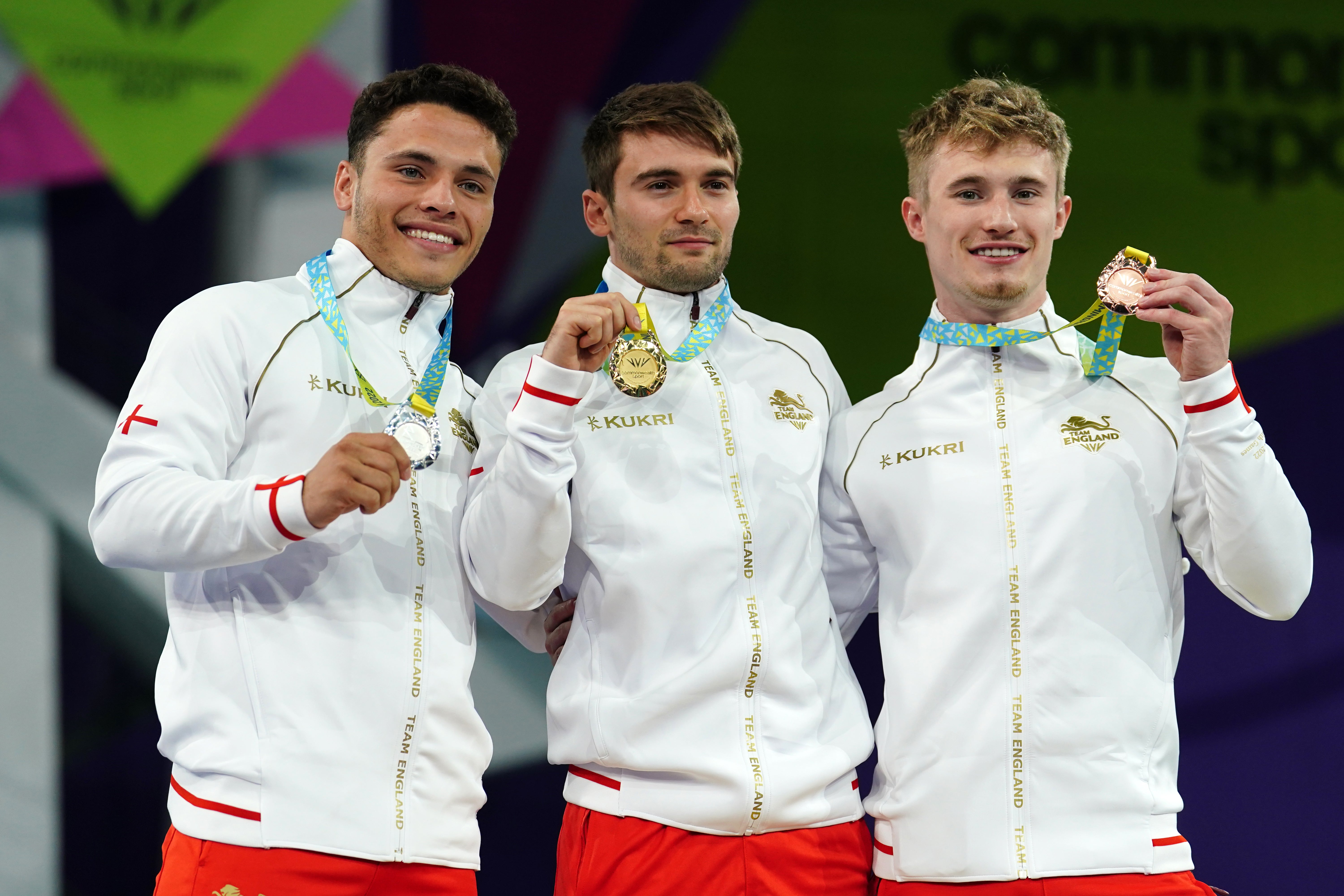 (Left to right) England’s Jordan Houlden, Daniel Goodfellow and Jack Laugher on the podium during the medal ceremony for the men’s 3m springboard final (David Davies/PA)