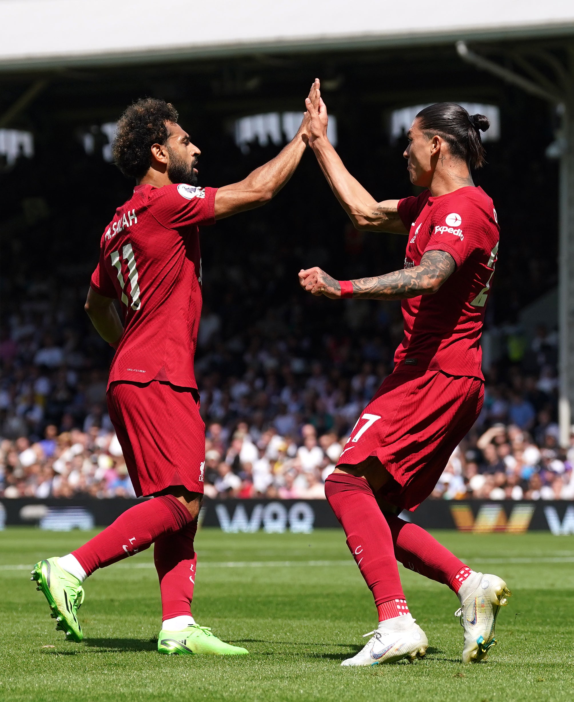 Liverpool’s Mohamed Salah, left, celebrates with Darwin Nunez, right, after scoring in their 2-2 draw with Fulham (Adam Davy/PA)