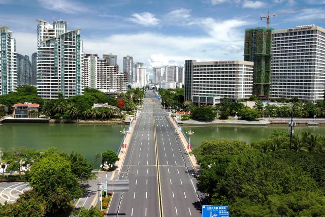 <p>This aerial photo taken on 7 August 2022 shows an empty road as the area is closed off and restricted due to an outbreak of the Covid-19 coronavirus in Hainan</p>