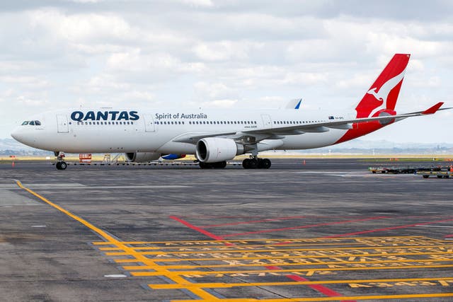 <p>An arriving Qantas Airbus A330 aircraft taxis at Auckland international airport on the first day of New Zealanders returning from Australia on 28 February 2022</p>