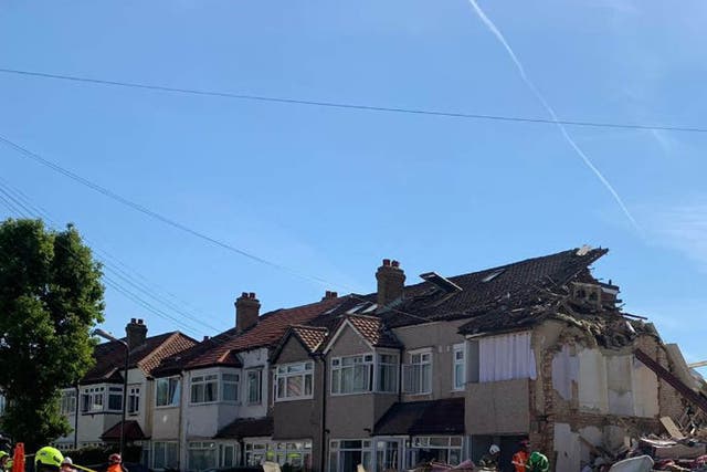 The scene in Galpin’s Road in Thornton Heath, south London, where three people were rescued after a house collapsed (London Fire Brigade /PA)