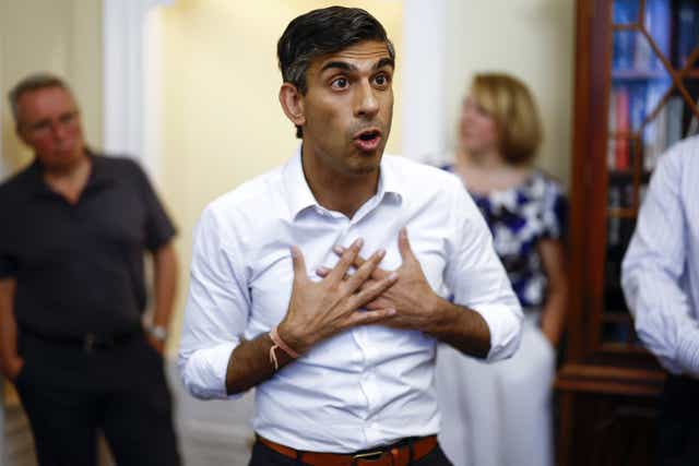 Rishi Sunak has been criticised for a campaign video which shows a person shredding papers marked ‘EU Legislation’ (PA)