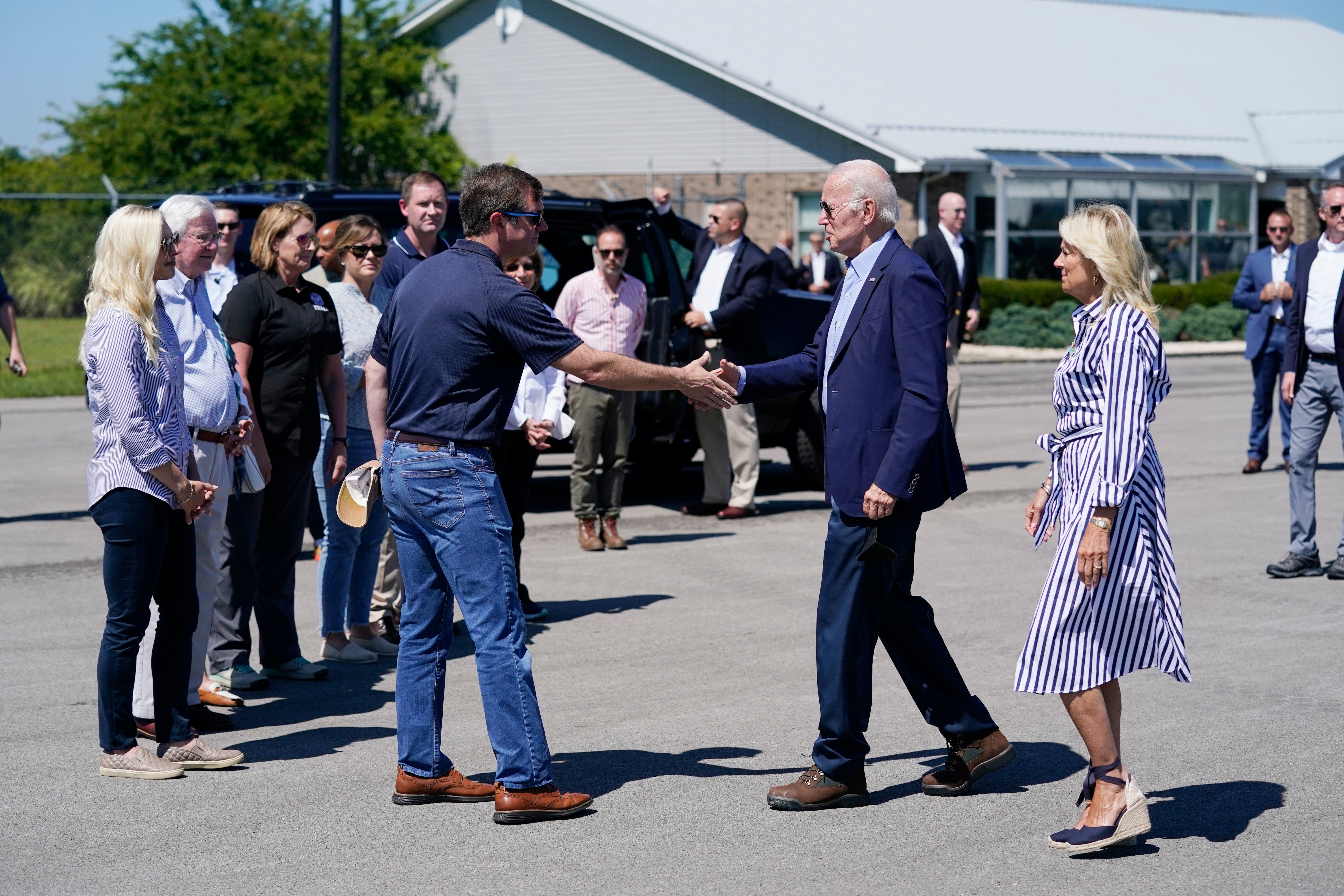 President Joe Biden and first lady Jill Biden are greeted by Kentucky Gov Andy Beshear