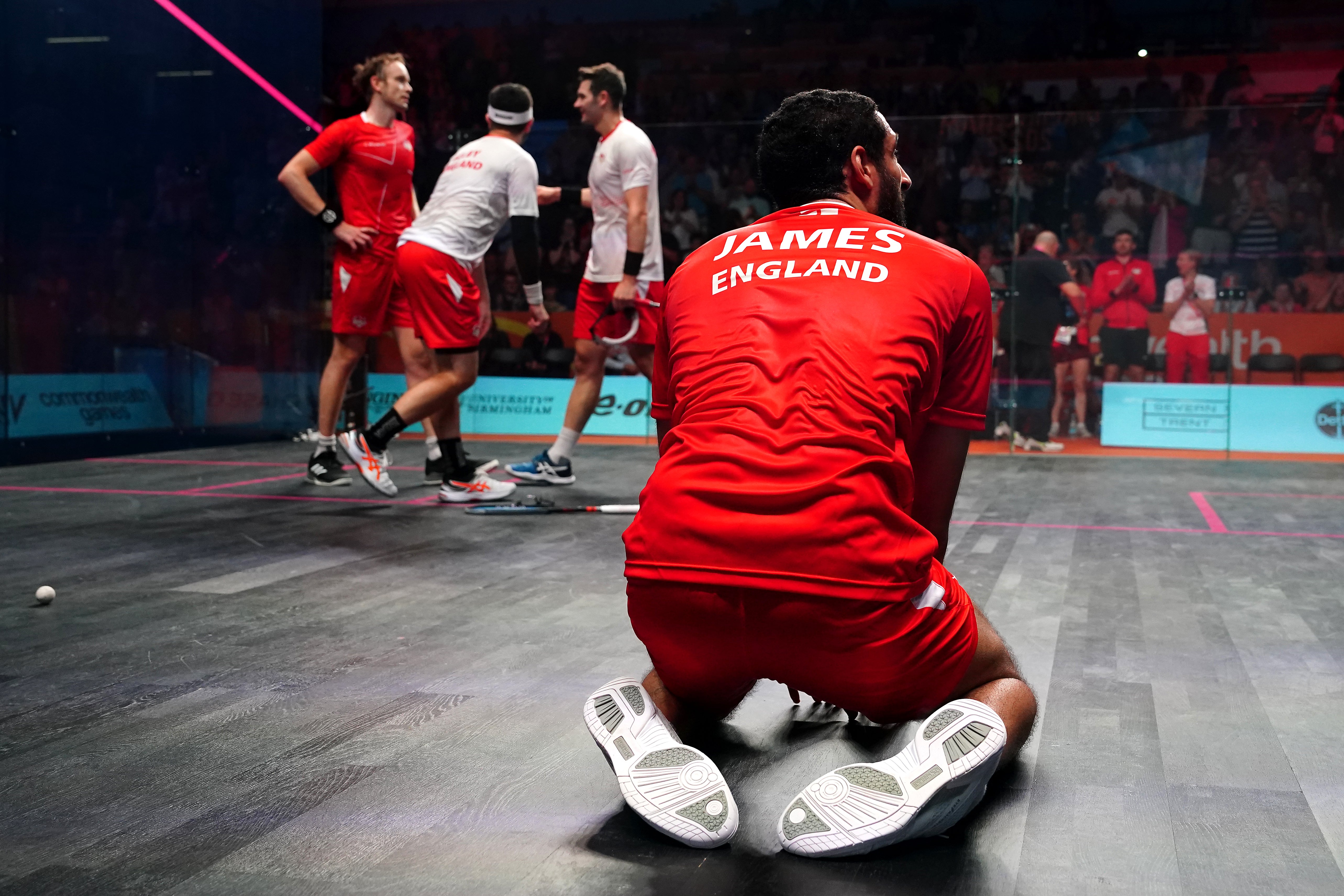 England’s Declan James celebrated victory in the men’s squash doubles gold medal match with team-mate James Willstrop against England’s Adrian Waller and Daryl Selby (Mike Egerton/PA)