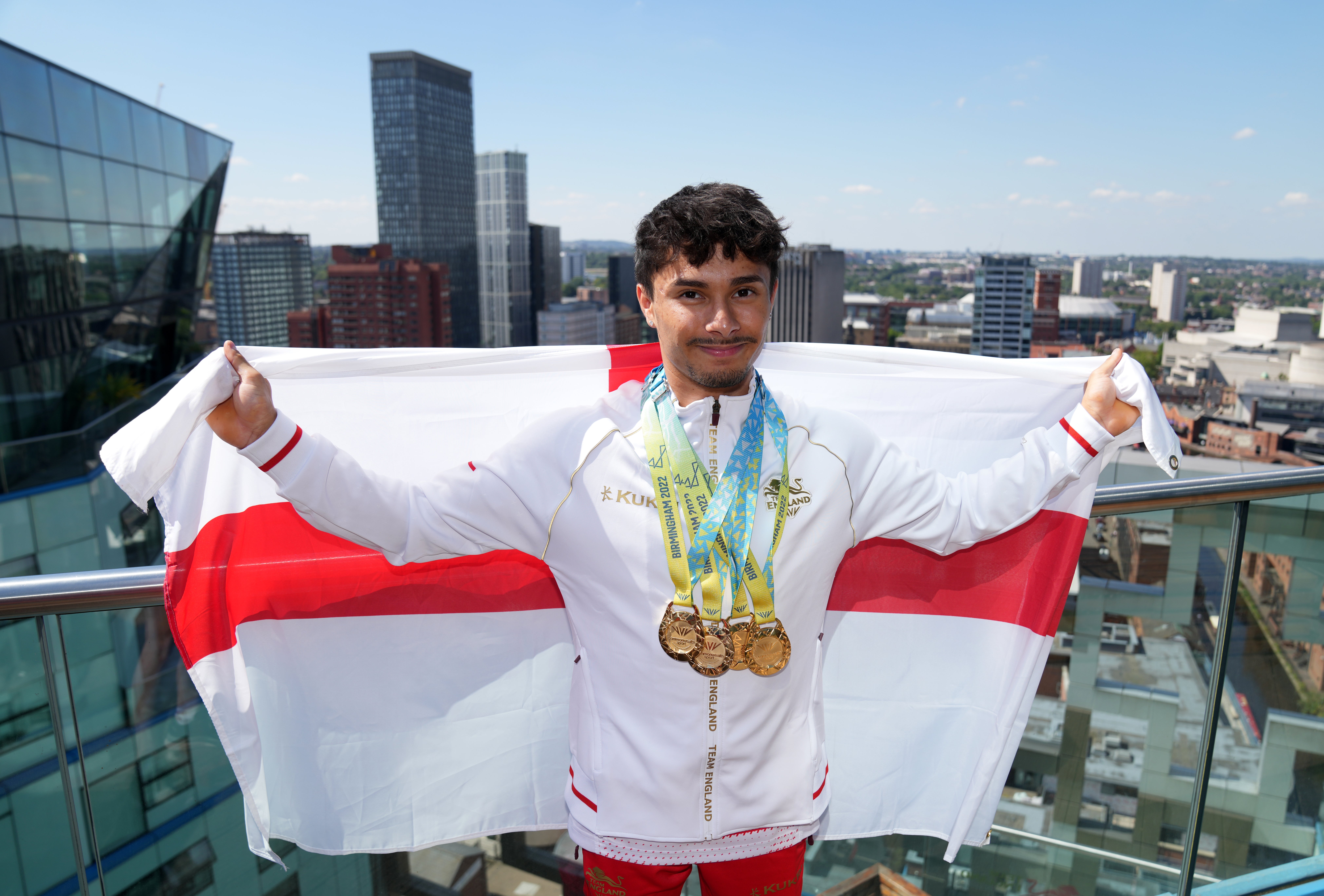 England gymnast Jake Jarman shows off his four gold medals won at Birmingham 2022 (Jacob King/PA)