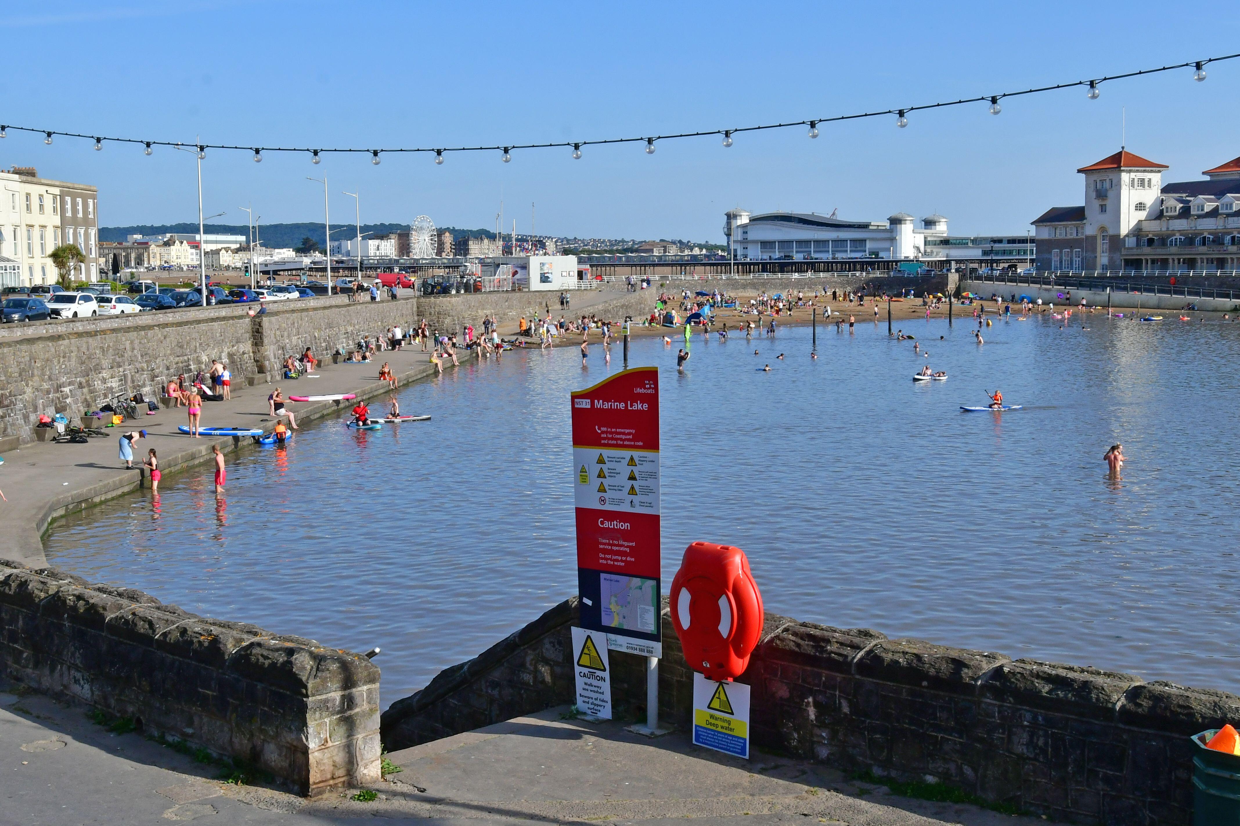 People cooling down in Weston Super Mare in July (Robert Timoney/Alamy/PA)