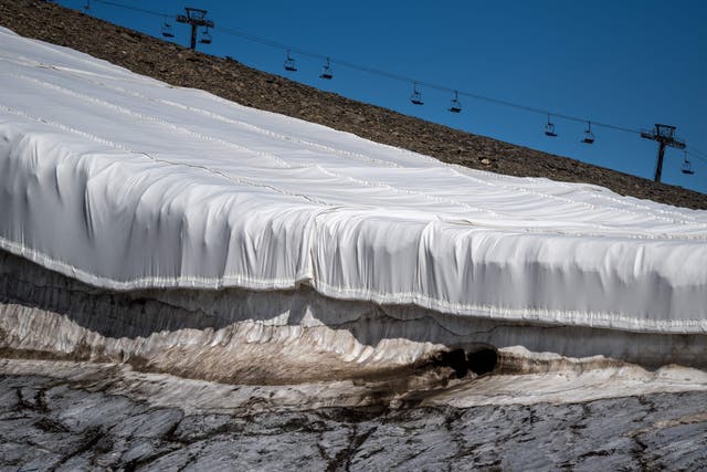 <p>Blankets covering snow to prevent it from melting at the Tsanfleuron glacier on Les Diablerets, Switzerland</p>