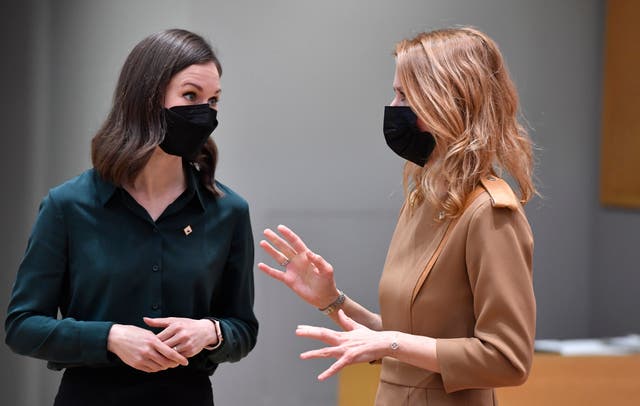 <p>Finland’s prime minister Sanna Marin (L) speaks with her Estonian counterpart Kaja Kallas in Brussels on 15 December, 2021.</p>