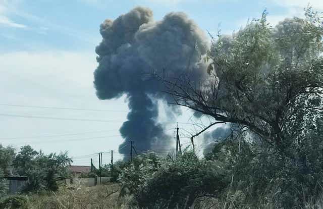 <p>Smoke rises after explosions were heard from the direction of a Russian military airbase</p>