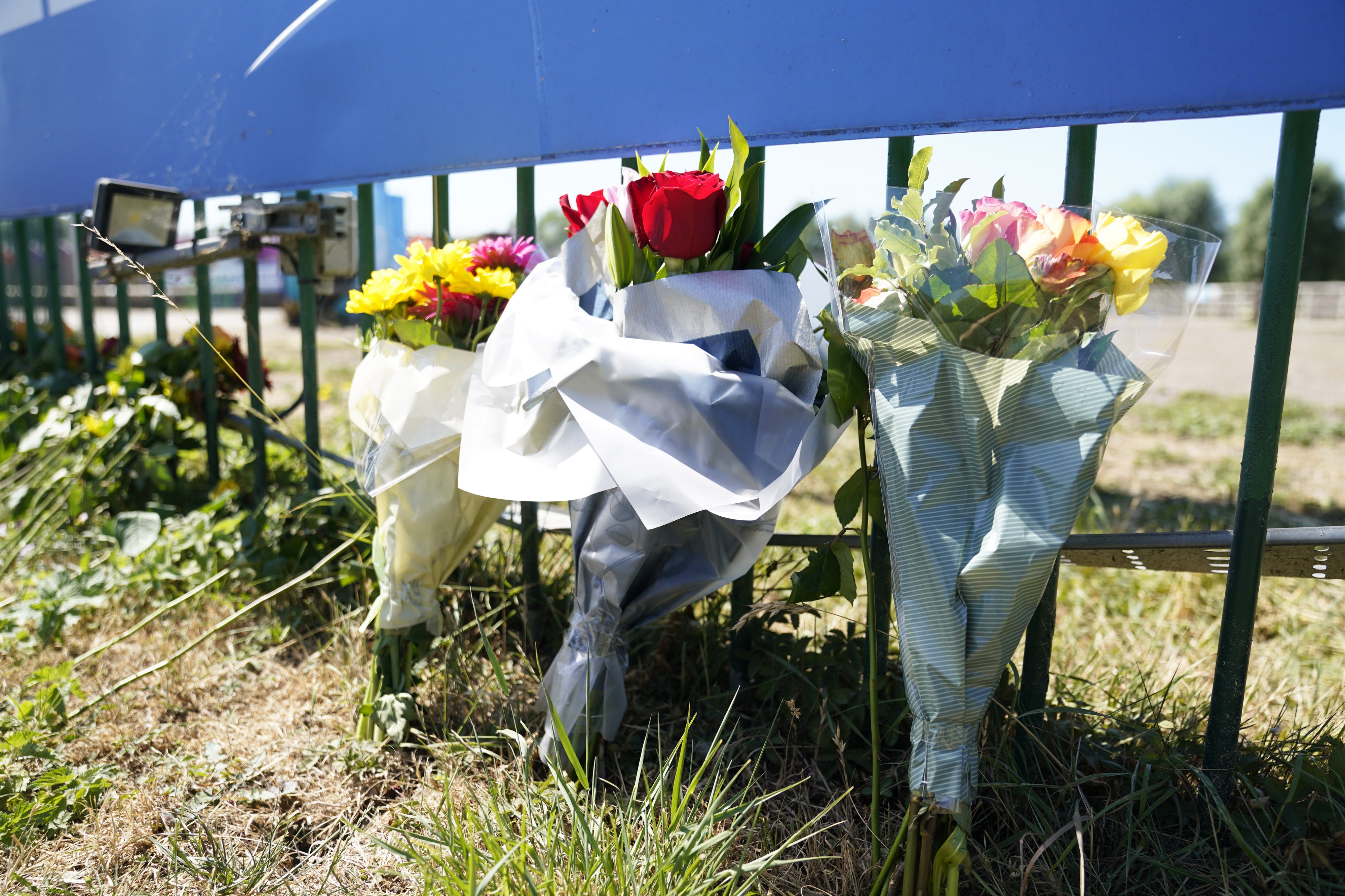 Flowers are left outside Liquid Leisure in Windsor, following the death of an 11-year-old girl (Andrew Matthews/PA)