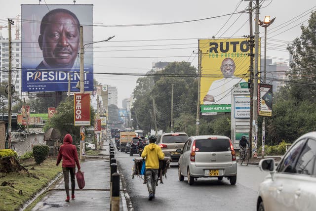 <p>Either Raila Odinga (poster left) or William Ruto (poster right) will become the next Kenyan president </p>