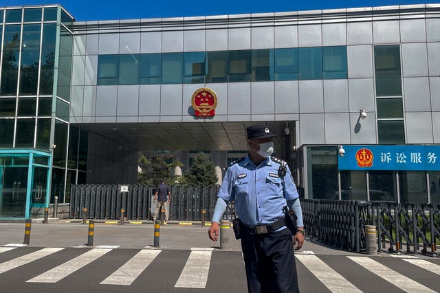 <p>A policeman stands in front of the No. 1 Intermediate People’s Court, where Zhou Xiaoxuan, a former intern at state broaster lost an appeal against CCTV host Zhu Jun </p>