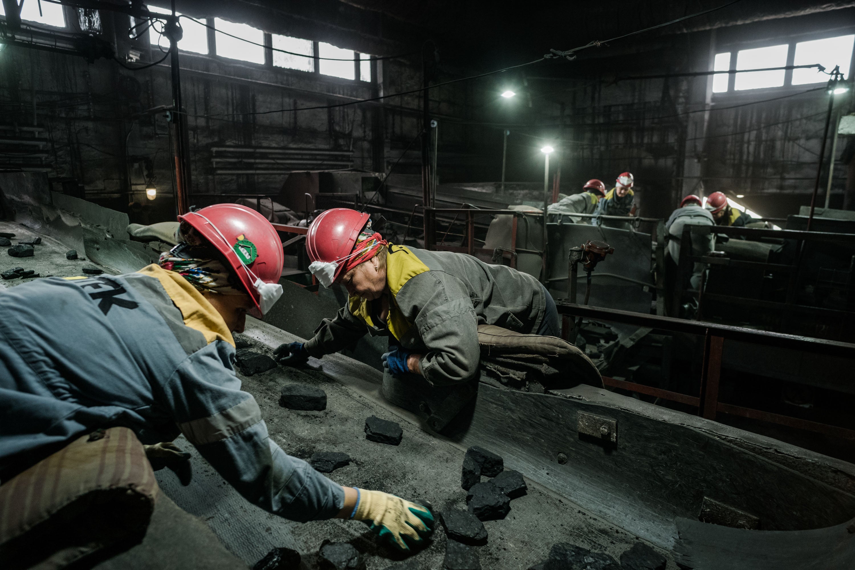 Workers sort coal in a mine in Ukraine's eastern Donbas region