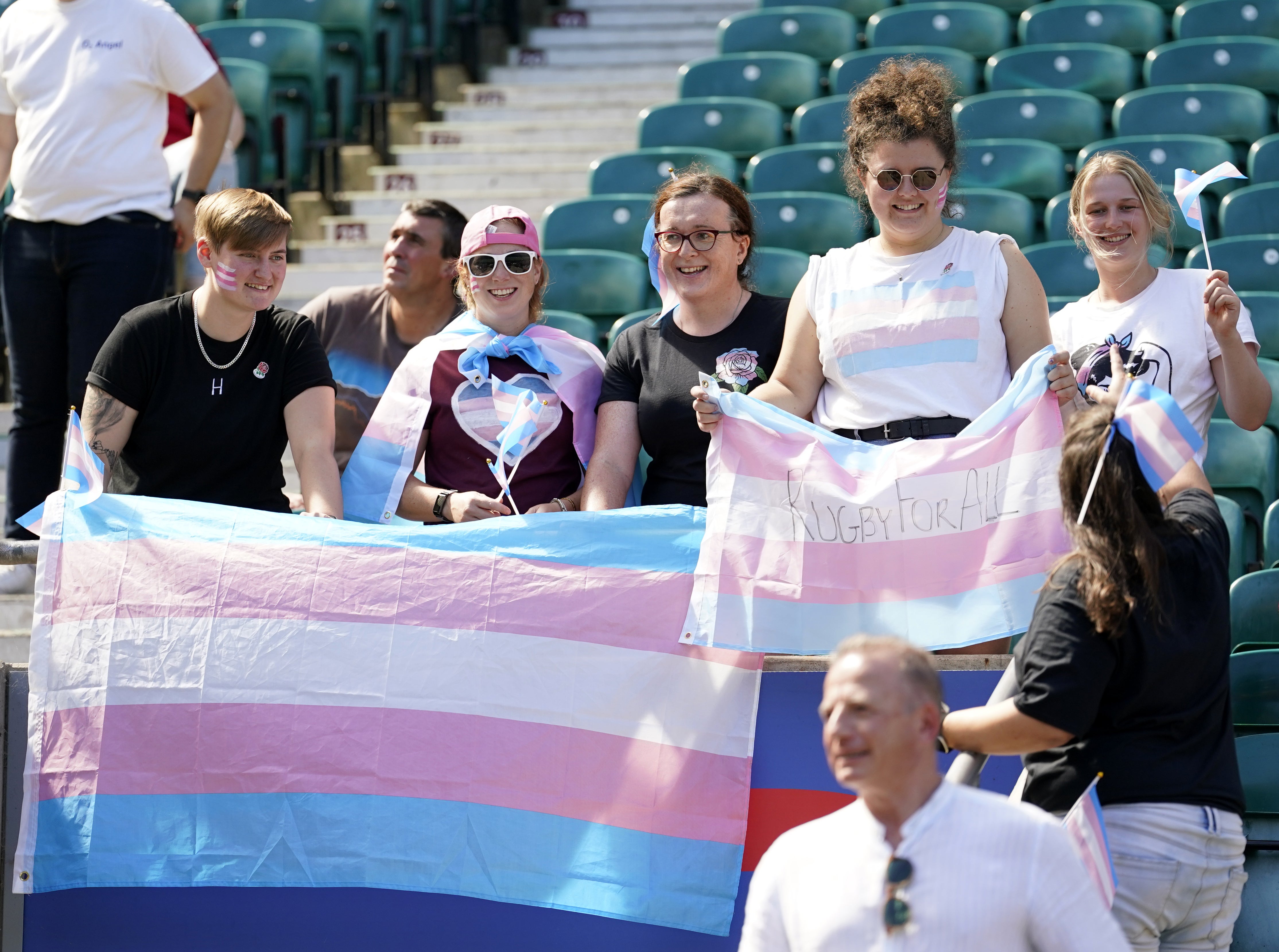 England fans with Transgender Pride flags in the stands after an open training session at Twickenham (Andrew Matthews/PA)