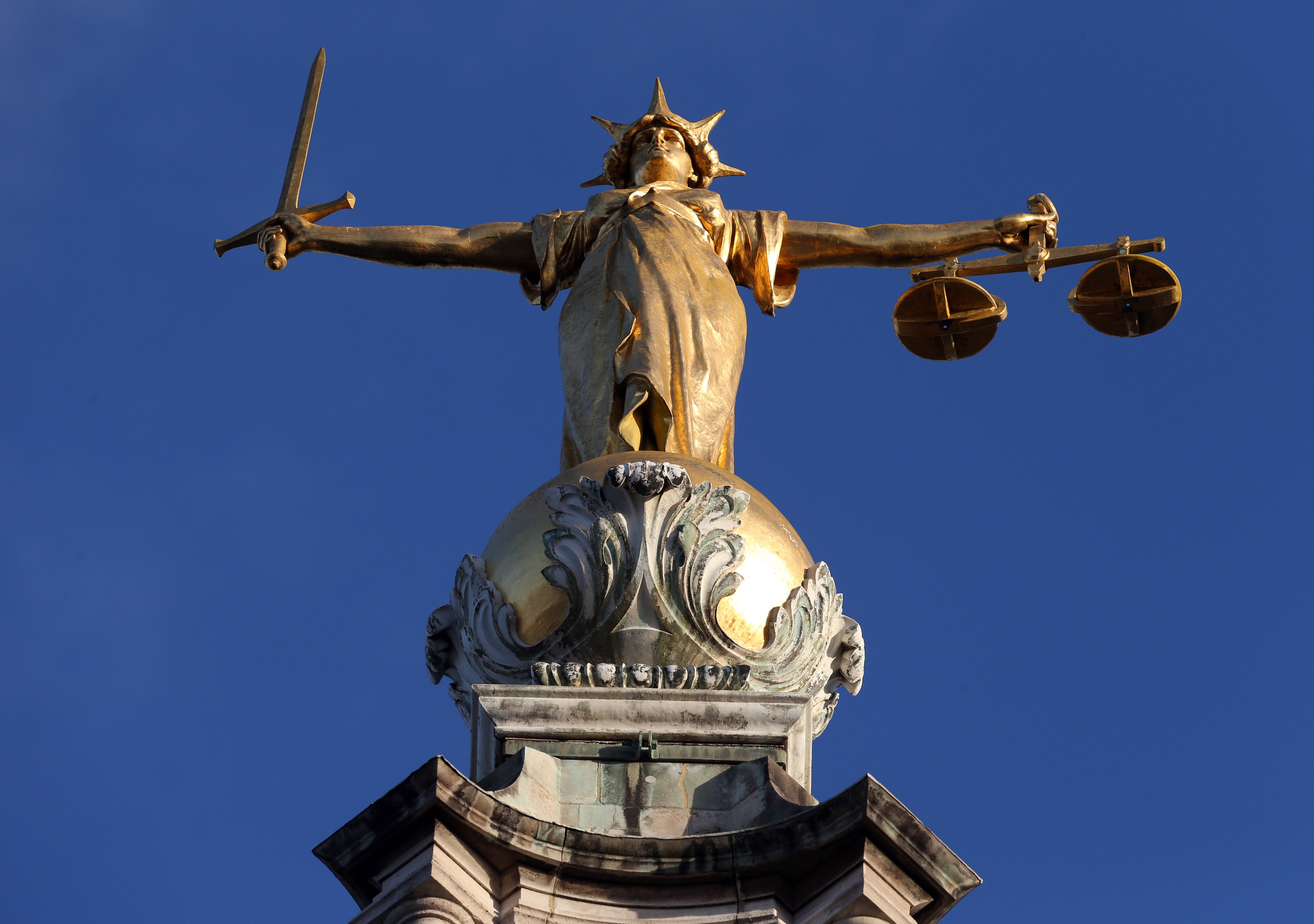 FW Pomeroy’s Statue of Justice stands atop the Central Criminal Court building, Old Bailey, London (Jonathan Brady/PA)