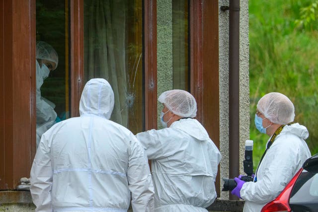 <p>Forensics officers at a property in the Dornie area of Wester Ross on the northwest coast of Scotland </p>
