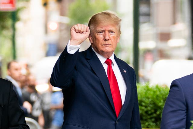 <p>Former President Donald Trump gestures as he departs Trump Tower, Wednesday, Aug. 10, 2022, in New York, on his way to the New York attorney general's office for a deposition in a civil investigation</p>