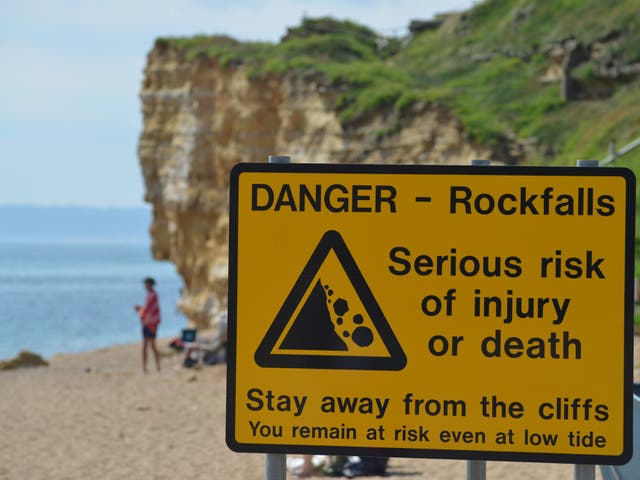 <p>A rockfall warning in Dorset where the council is urging people to take precautions around the cliffs during the hot dry weather</p>