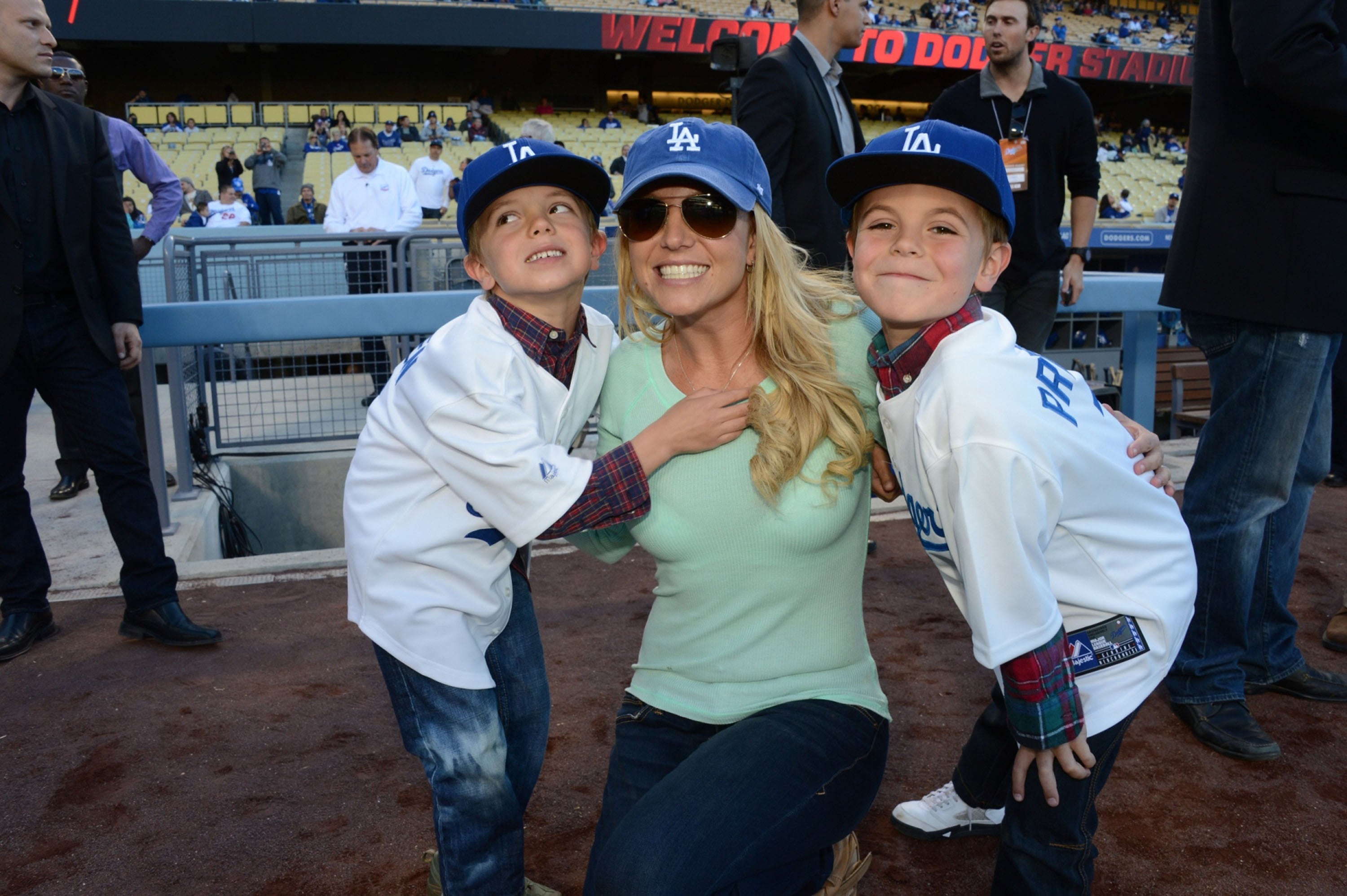 Britney Spears poses with her sons Jayden James and Preston at Dodger Stadium in 2013