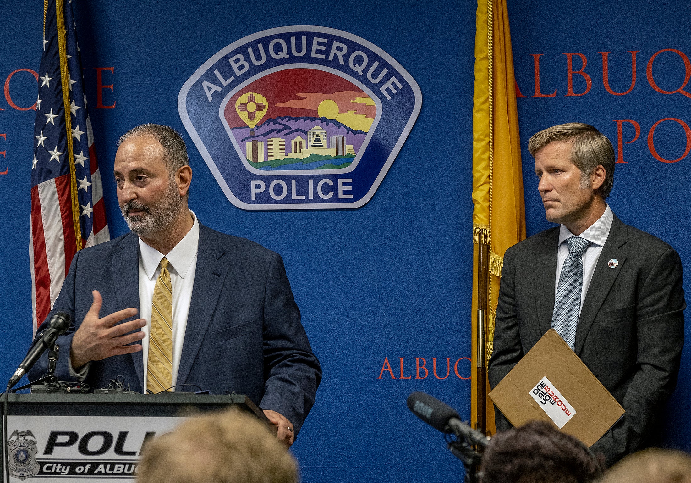 Ahmad Assed, president of the Islamic Center of New Mexico, left, speaks at a news conference to announce the arrest of the alleged perpetrator